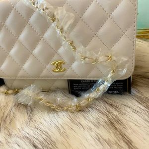 Chanel small shoulder wallet.